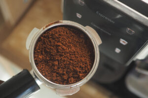 Ground coffee fills a portafilter